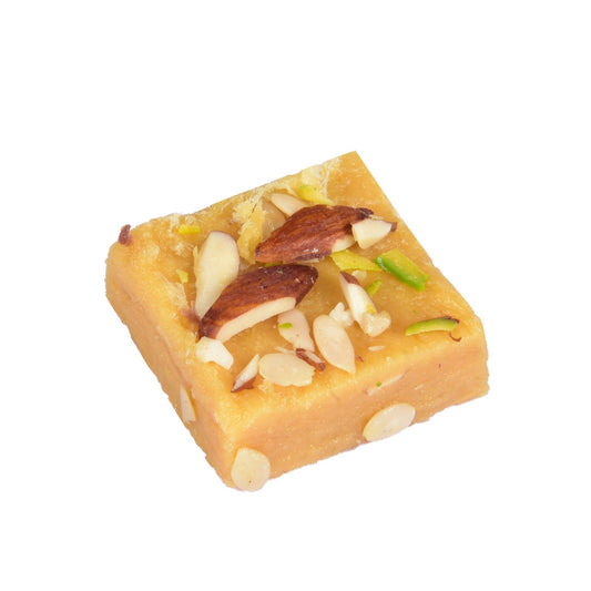 Square piece of sweet dish with nuts on a white background